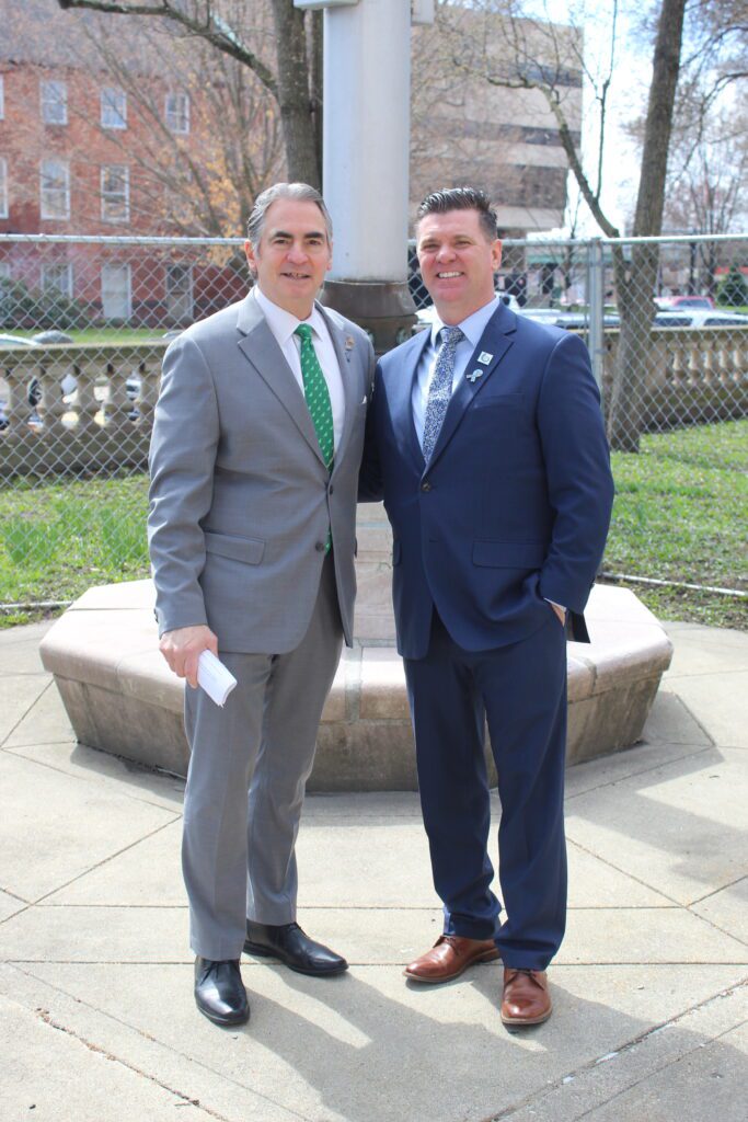 Mayor Sarno and Helix Human Services CEO Mark Paglia pose for a photo at the Child Abuse Prevention flag raising ceremony.